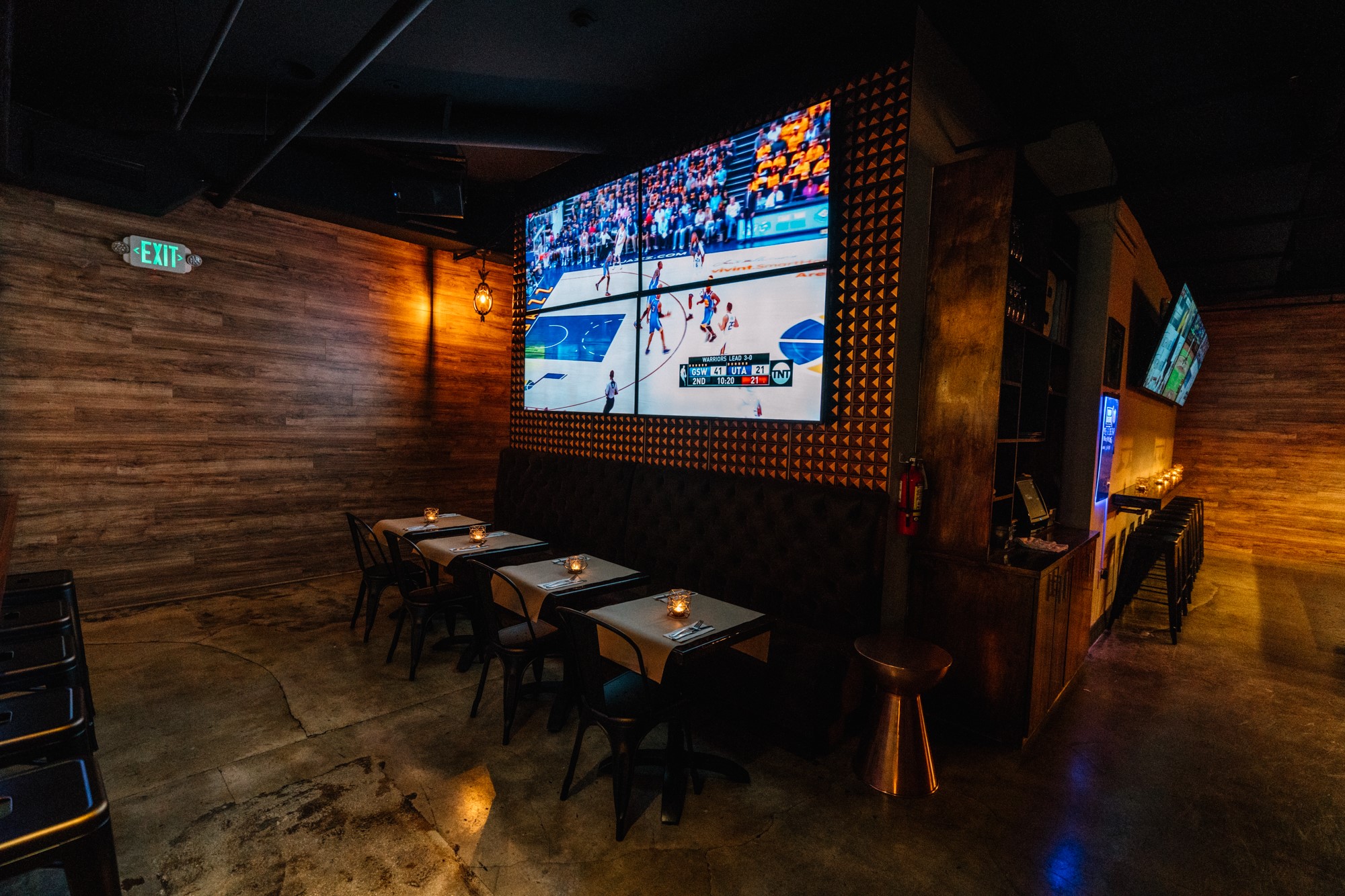 Booth seating beneath the main video wall during an NBA broadcast