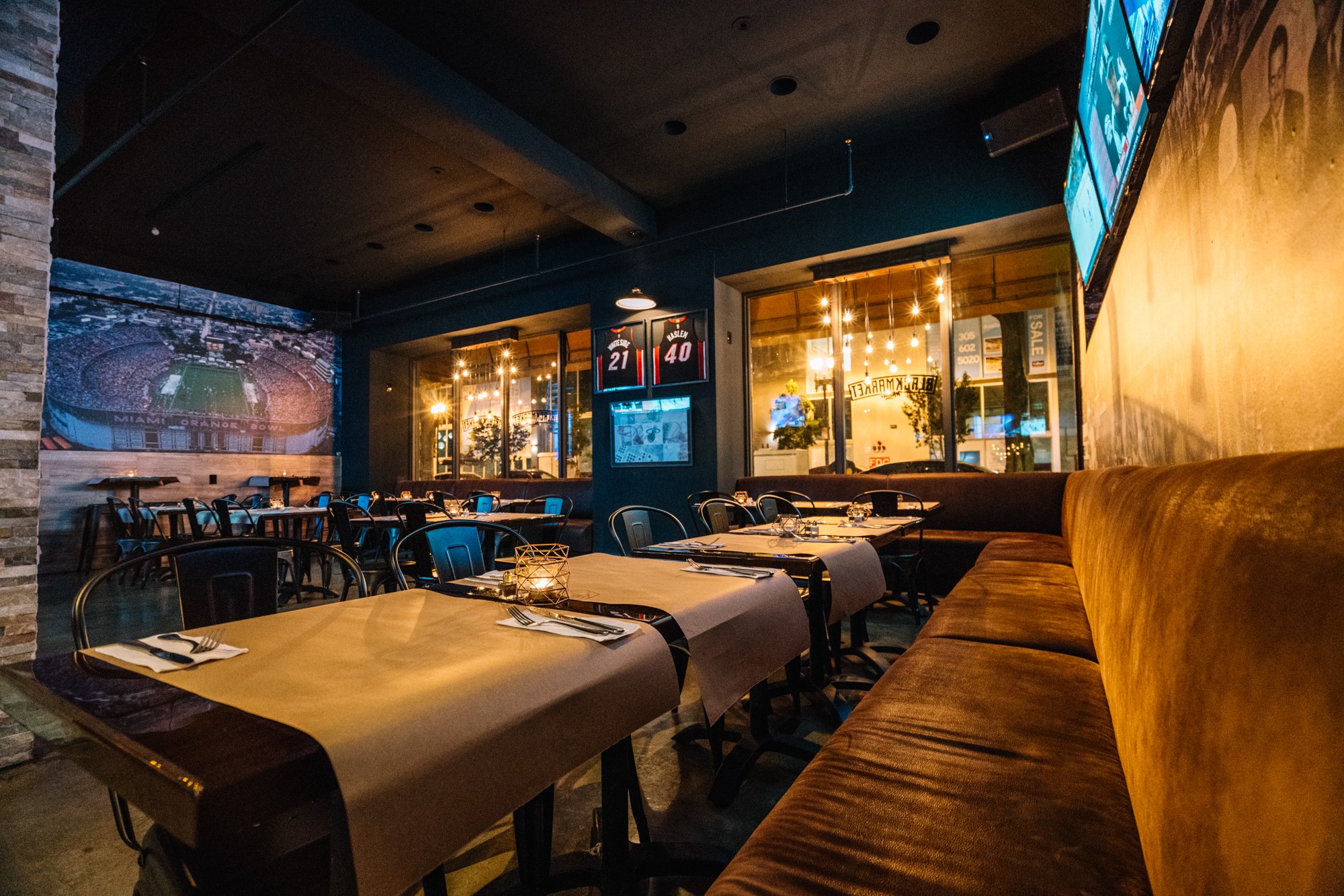 Dining room with Heat jerseys and the Orange Bowl mural