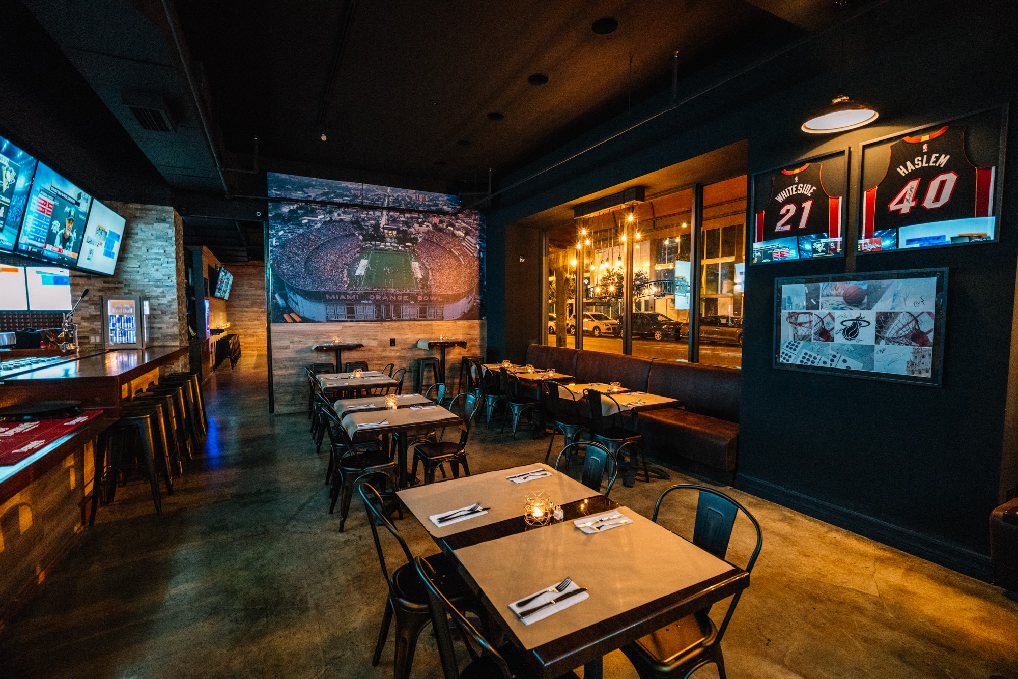 Banquette dining with framed Whiteside and Haslem jerseys