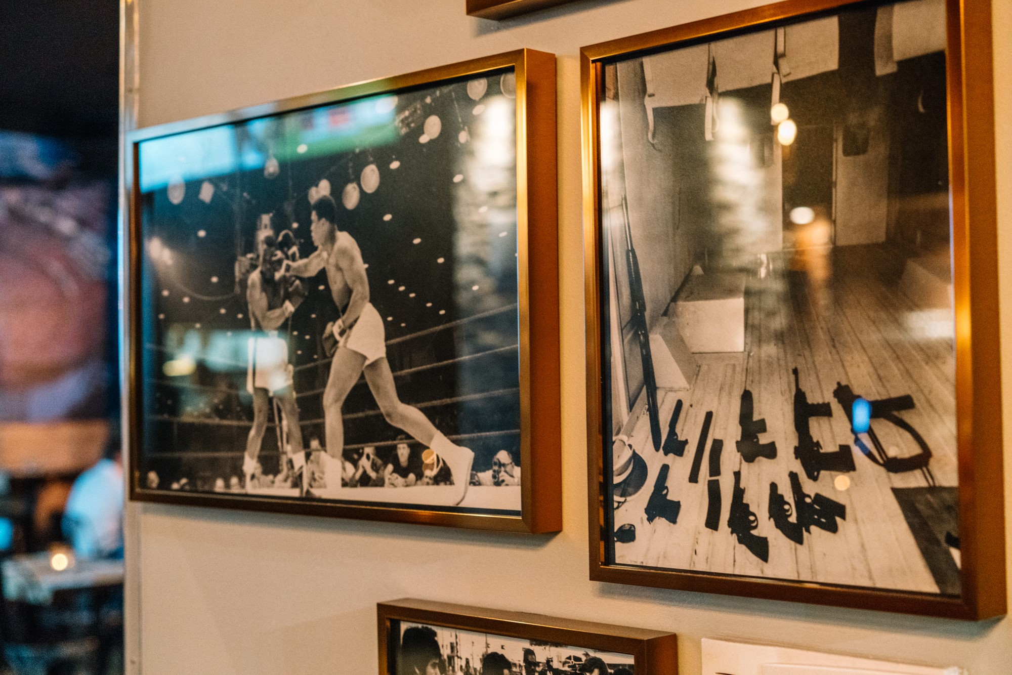 Framed black-and-white prints — Muhammad Ali in the ring beside a Scarface still-life