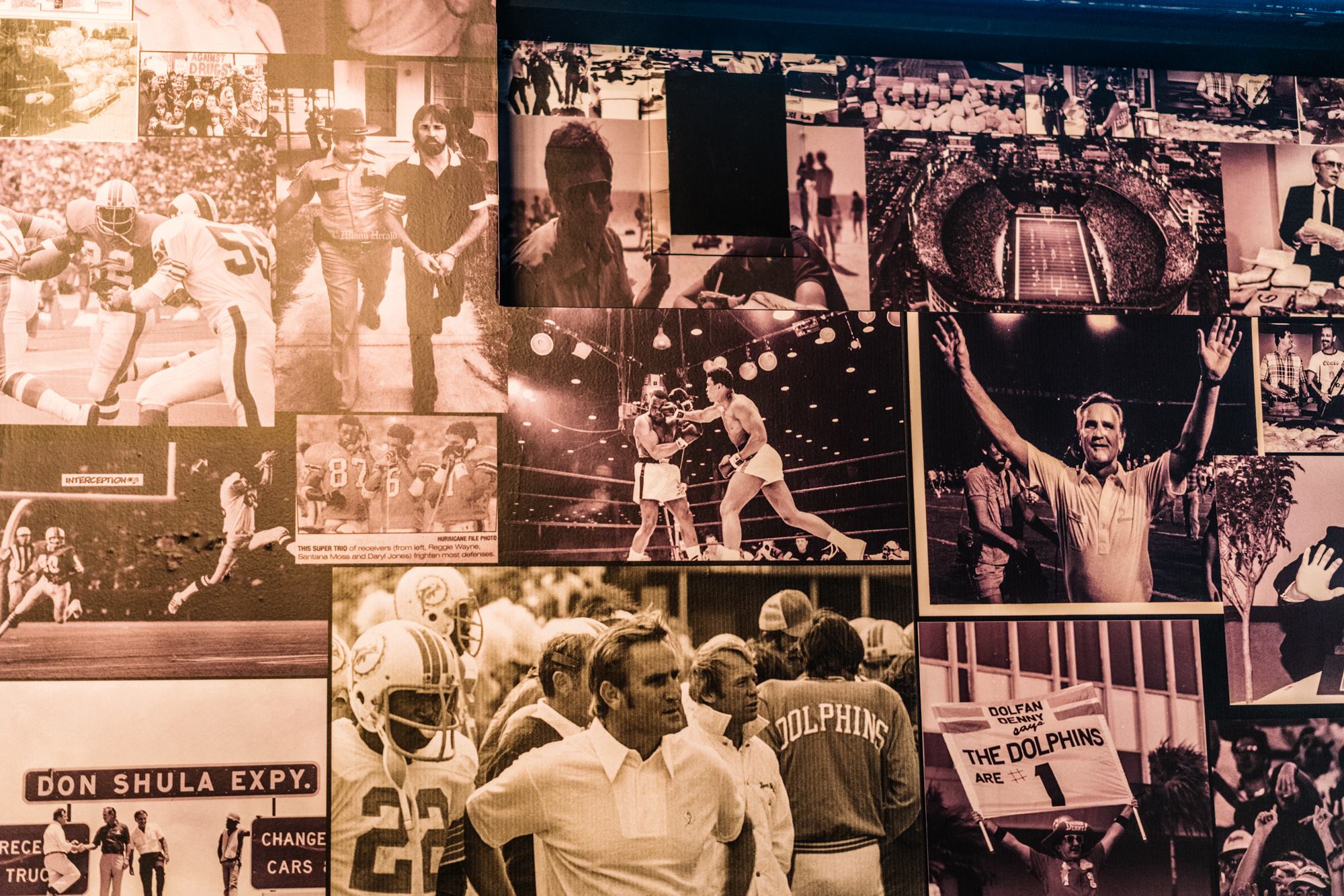 Sepia-toned collage wall of vintage Dolphins, Hurricanes and boxing photography