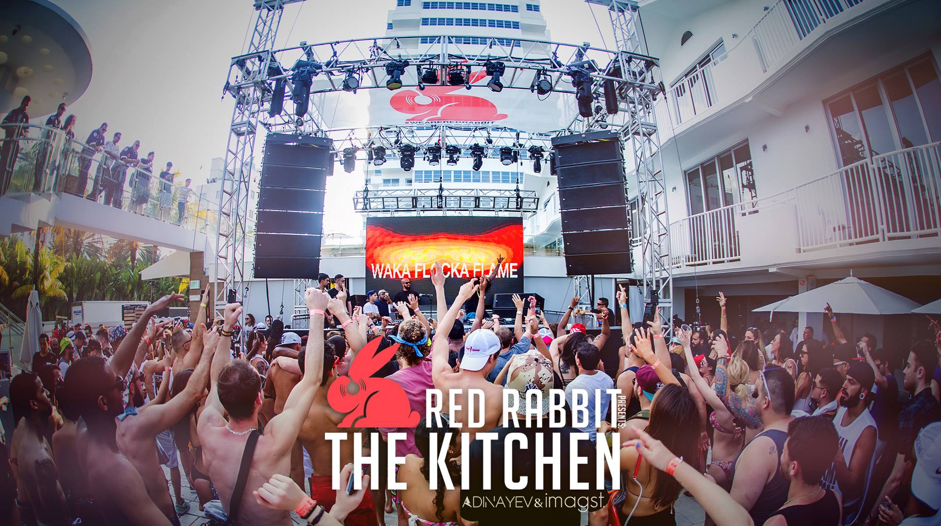 Headliner commanding a packed crowd with the Red Rabbit logo overlaid