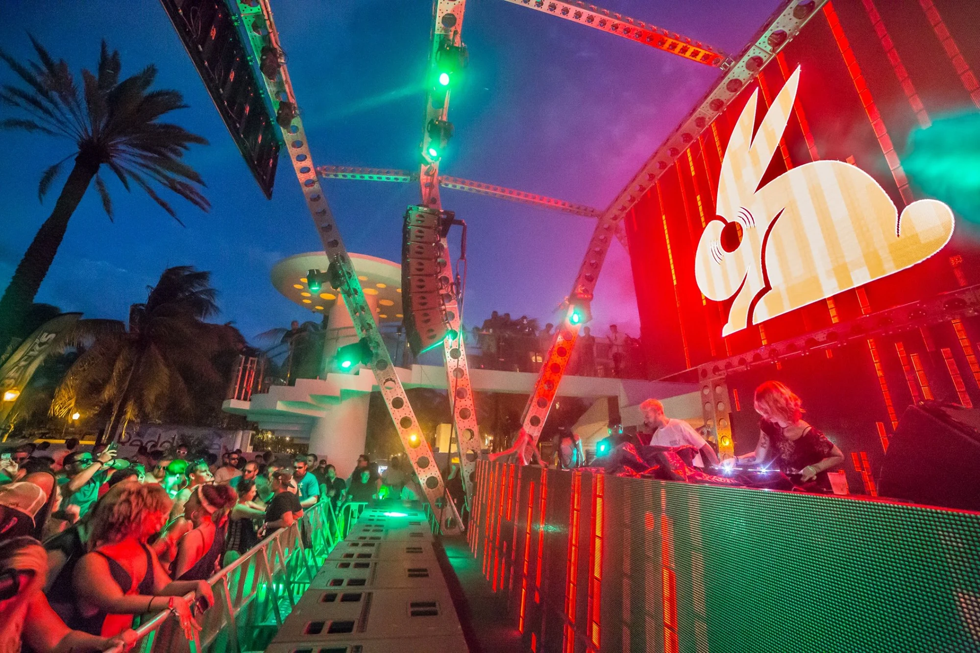 Wide view of the pool party crowd and main stage
