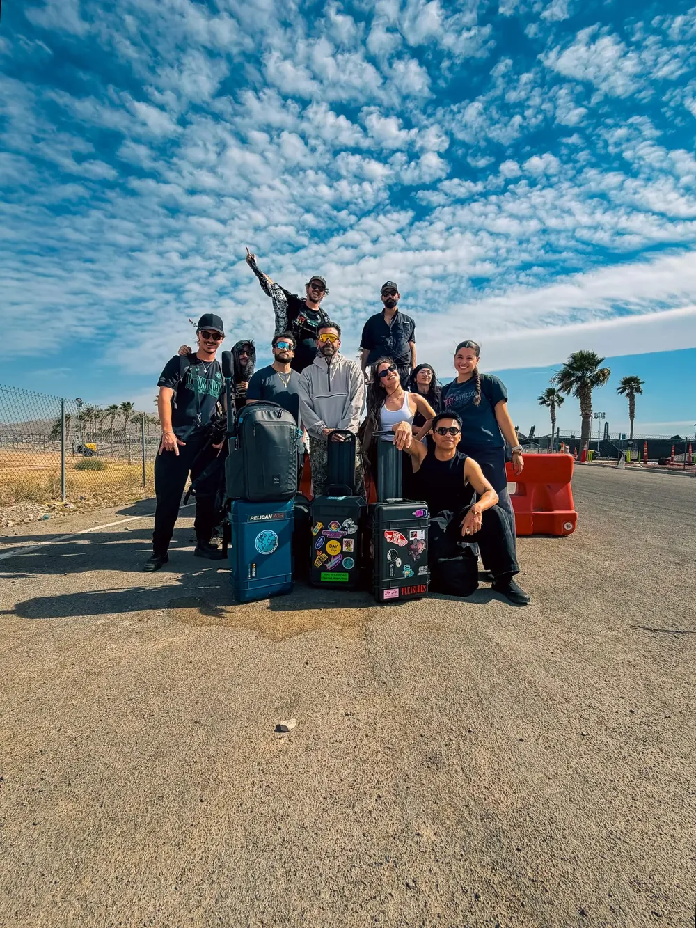 Insomniac media crew posing with Pelican camera cases outside the EDC Las Vegas festival gates