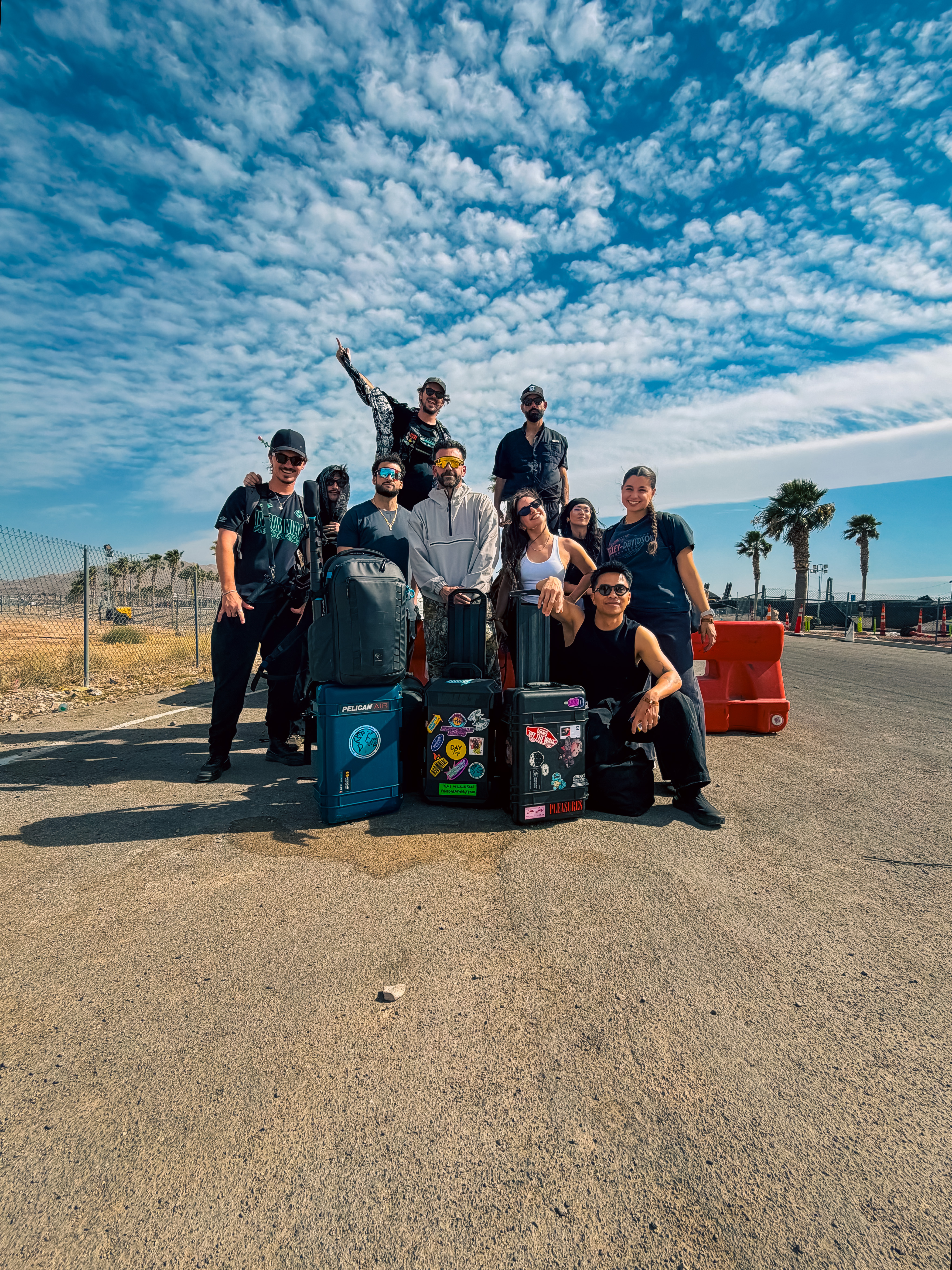Insomniac media crew posing with Pelican camera cases outside the EDC Las Vegas festival gates