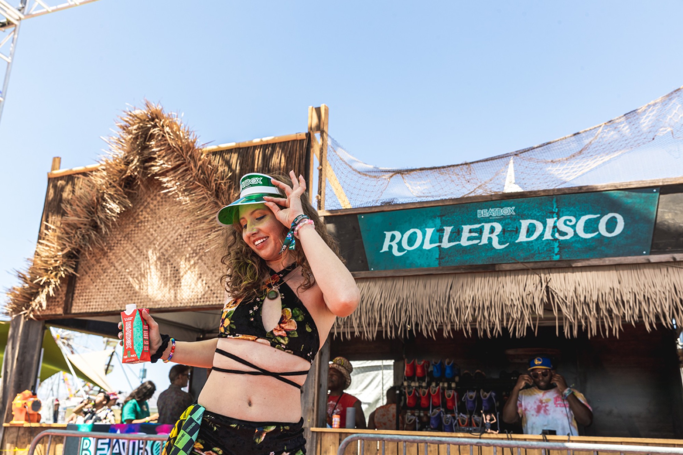 BeatBox Roller Disco activation &mdash; fan in a BeatBox visor at the tiki booth
