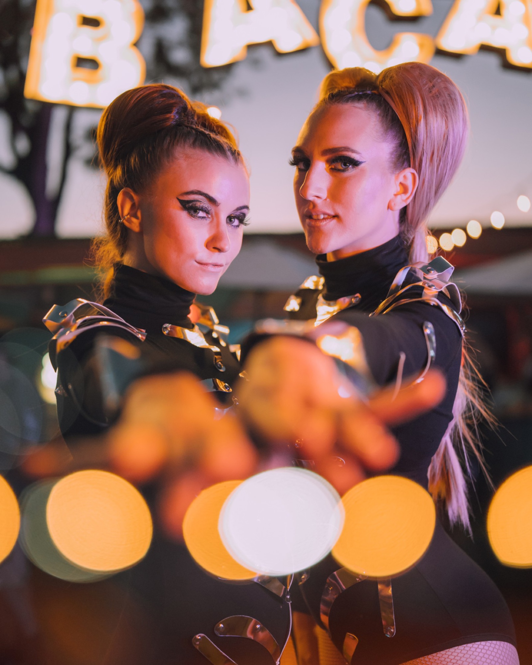 Dancers under the Bacard&iacute; marquee lights