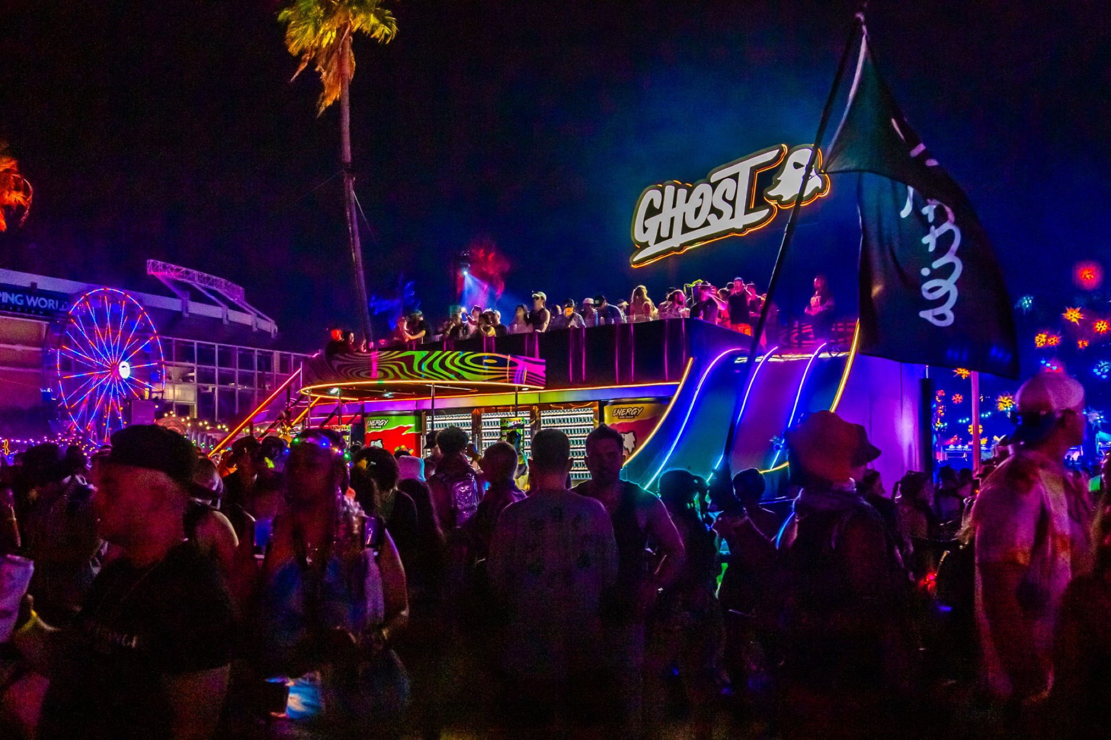 GHOST Energy bar glowing over the EDC midway