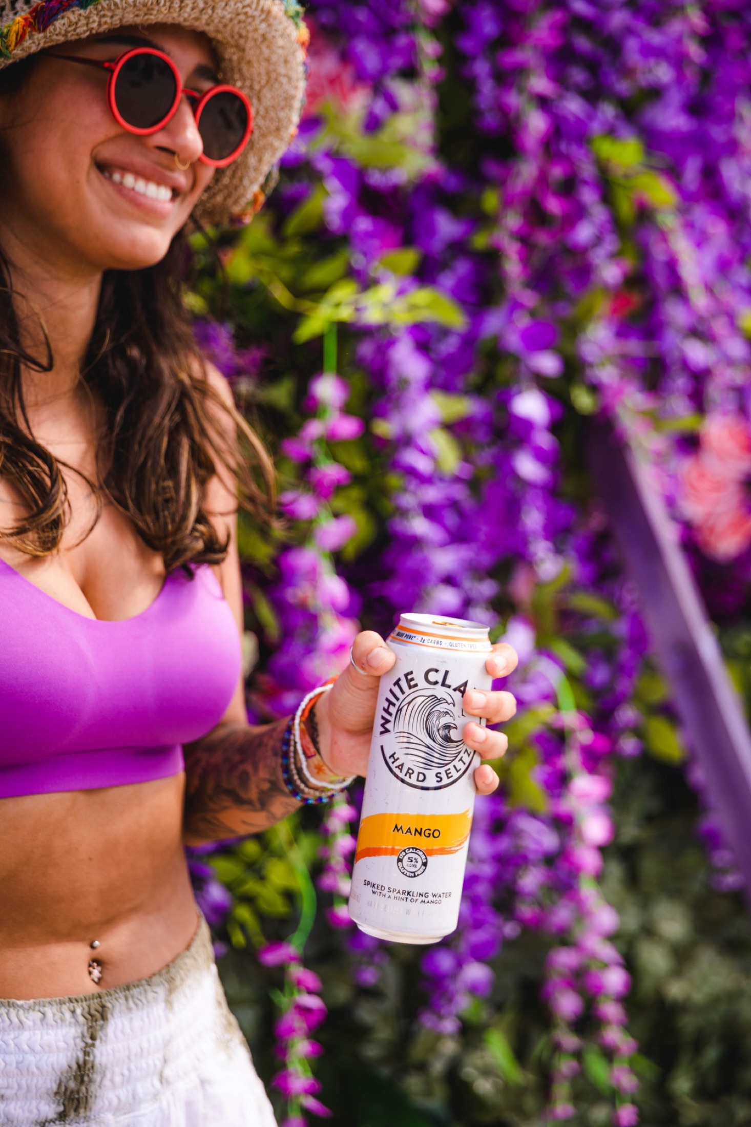 White Claw Mango against the flower wall